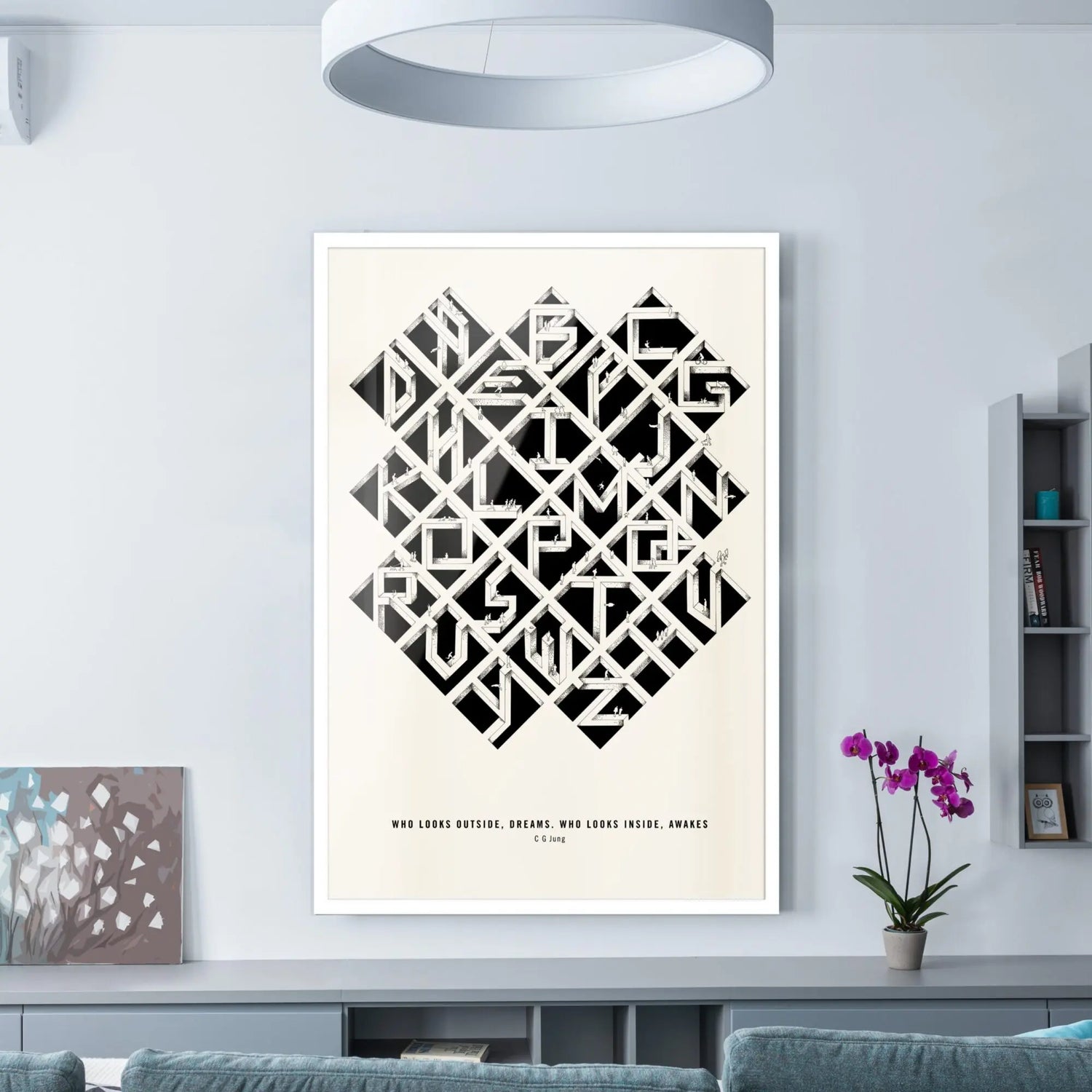 Alfalfabet typographic poster in white frame displayed in modern minimalist living room with blue-gray sofa and orchid plant