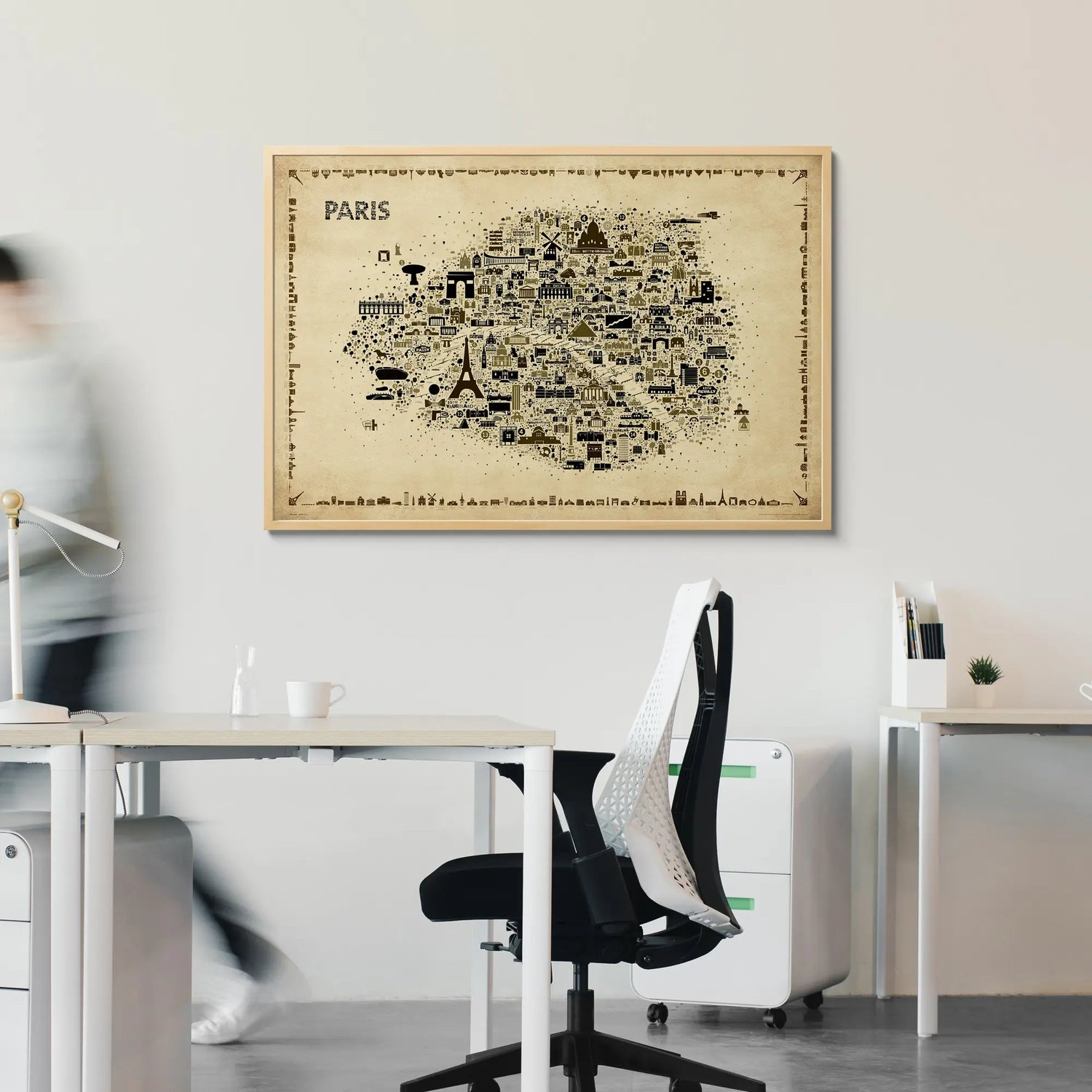 Framed map of Paris on a wall in an office setting
