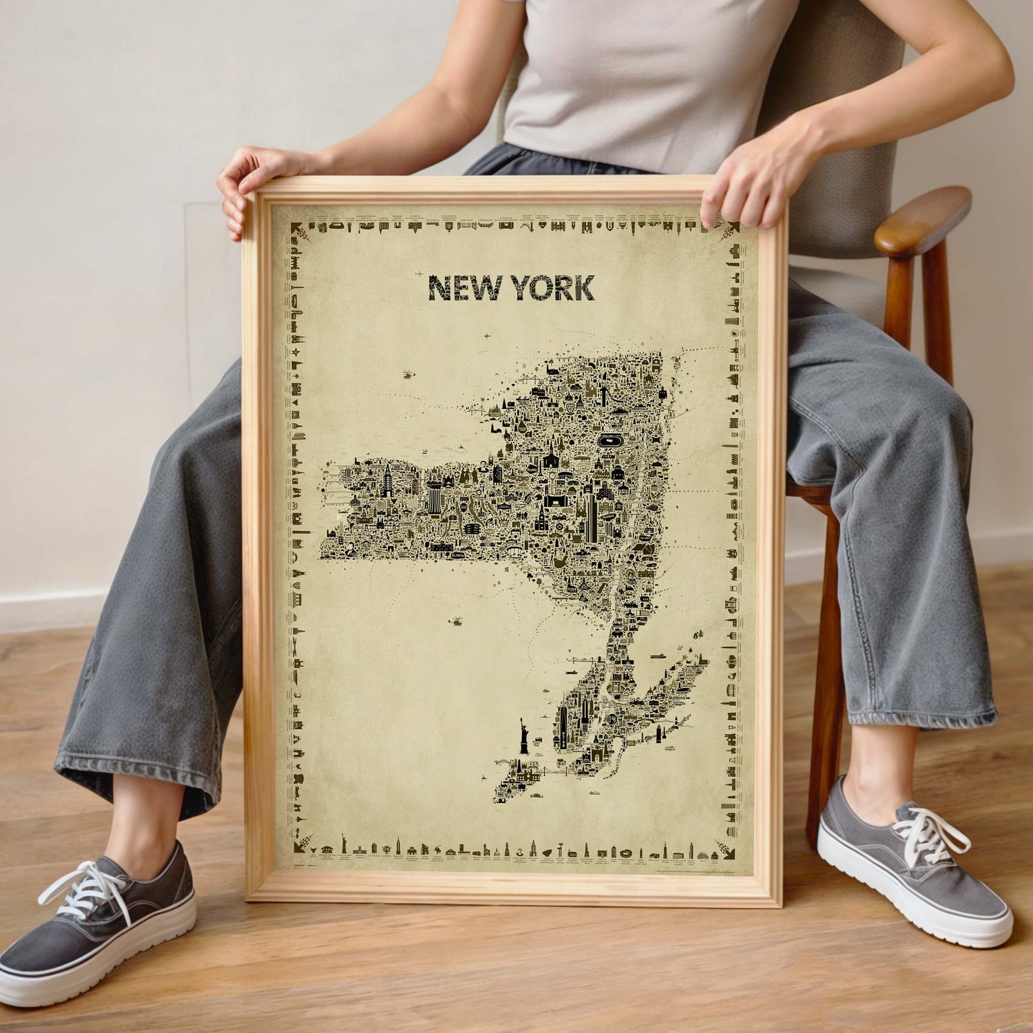 Woman holding the Iconic New York State Antique Map Poster in a natural wood frame, showing real-life scale for this vintage Empire State wall art print and travel souvenir.