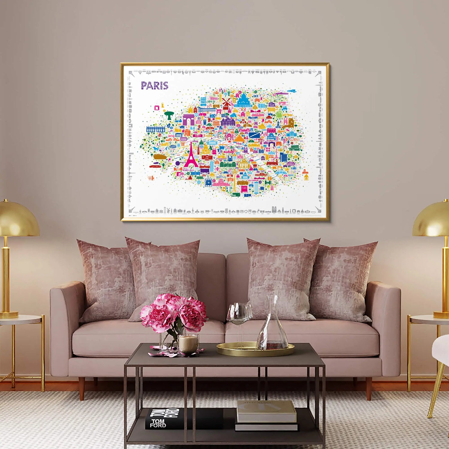 Iconic Paris colorful illustrated map poster in gold frame displayed above elegant blush pink velvet sofa in luxury living room