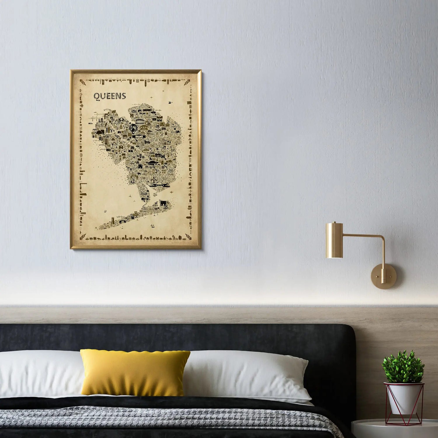 Iconic Queens antique map poster in gold frame hanging above modern bedroom headboard with brass wall sconce and minimalist decor