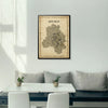 Framed map of New Delhi on a wall above a modern white sofa with a coffee table.