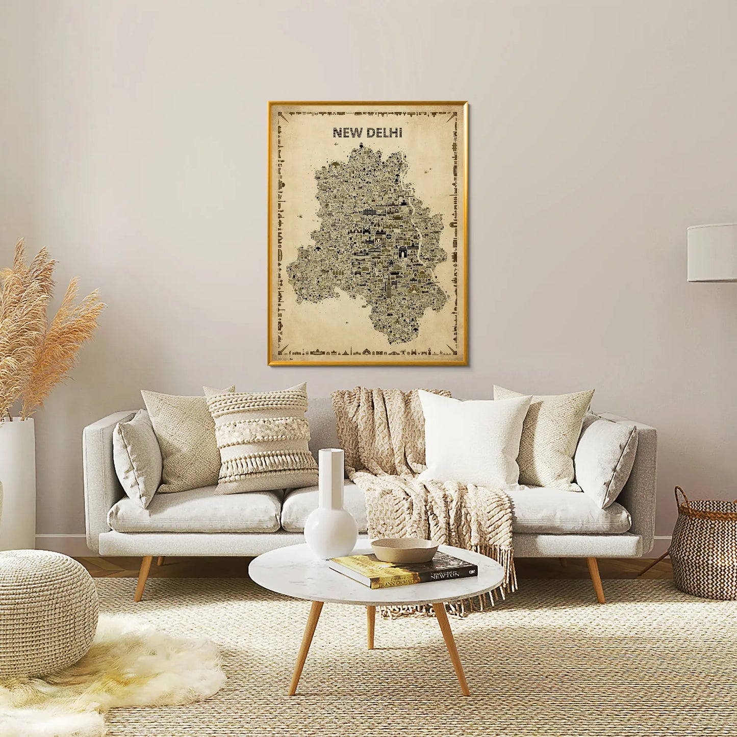 Living room with a sofa, coffee table, and decorative items including a map of New Delhi on the wall.