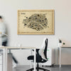 Framed map of Paris on a wall in an office setting