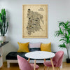 Living room with a map of The Bronx on the wall, pink chairs, and a white table.