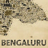 Close-up view of Bengaluru city map art print showcasing intricate hand-drawn landmarks and typography on a vintage beige background with an airplane illustration.