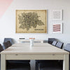 Bengaluru vintage map art print framed in light wood, elegantly displayed in a modern dining room with minimalist furniture and soft neutral tones.