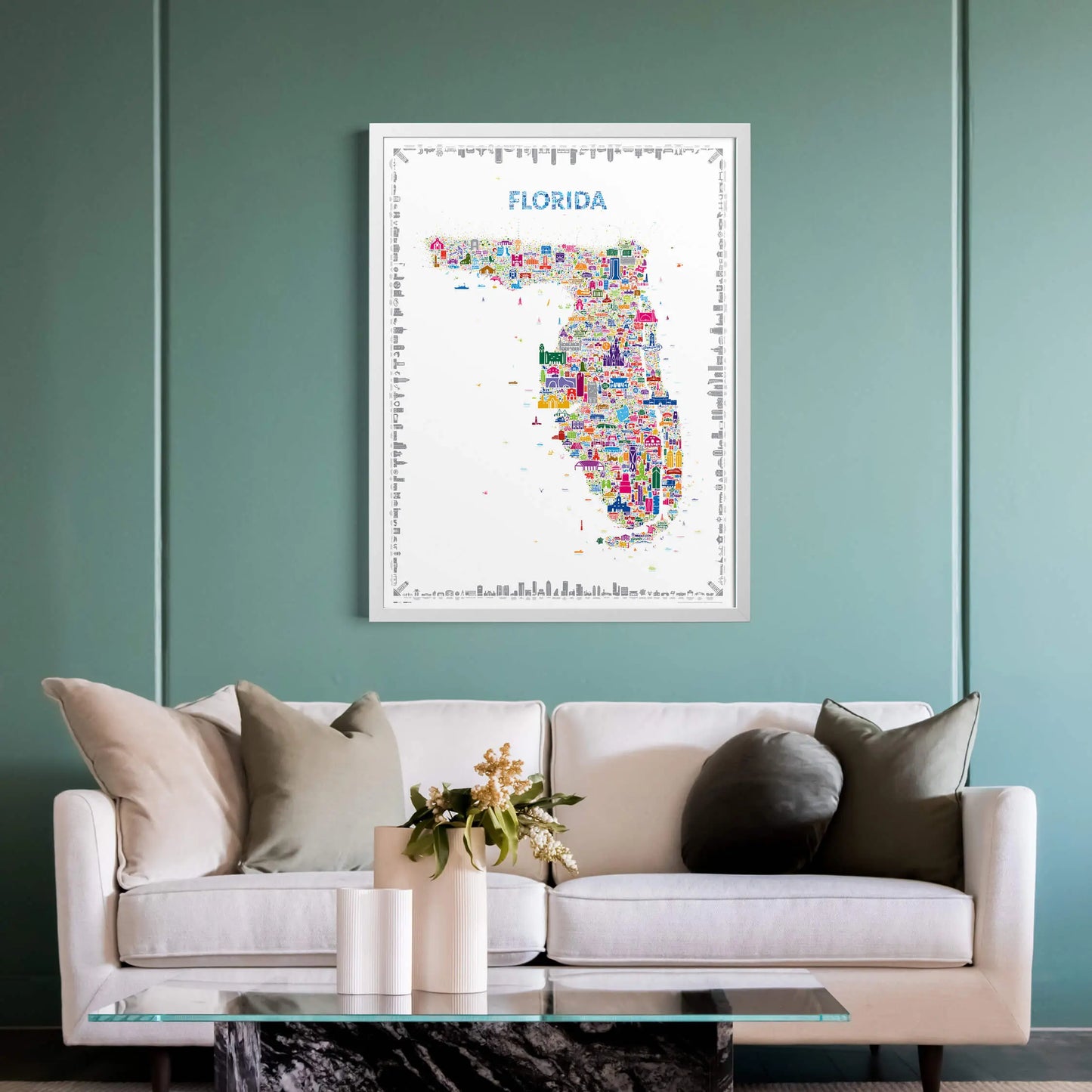 Colorful map of Florida on a wall above a white sofa with decorative pillows.