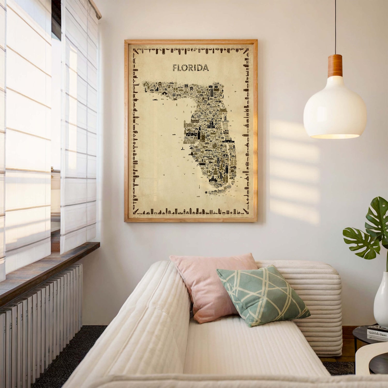 Florida antique map poster in sepia tones with wood frame above neutral sofa, classic wall art décor for elegant living room