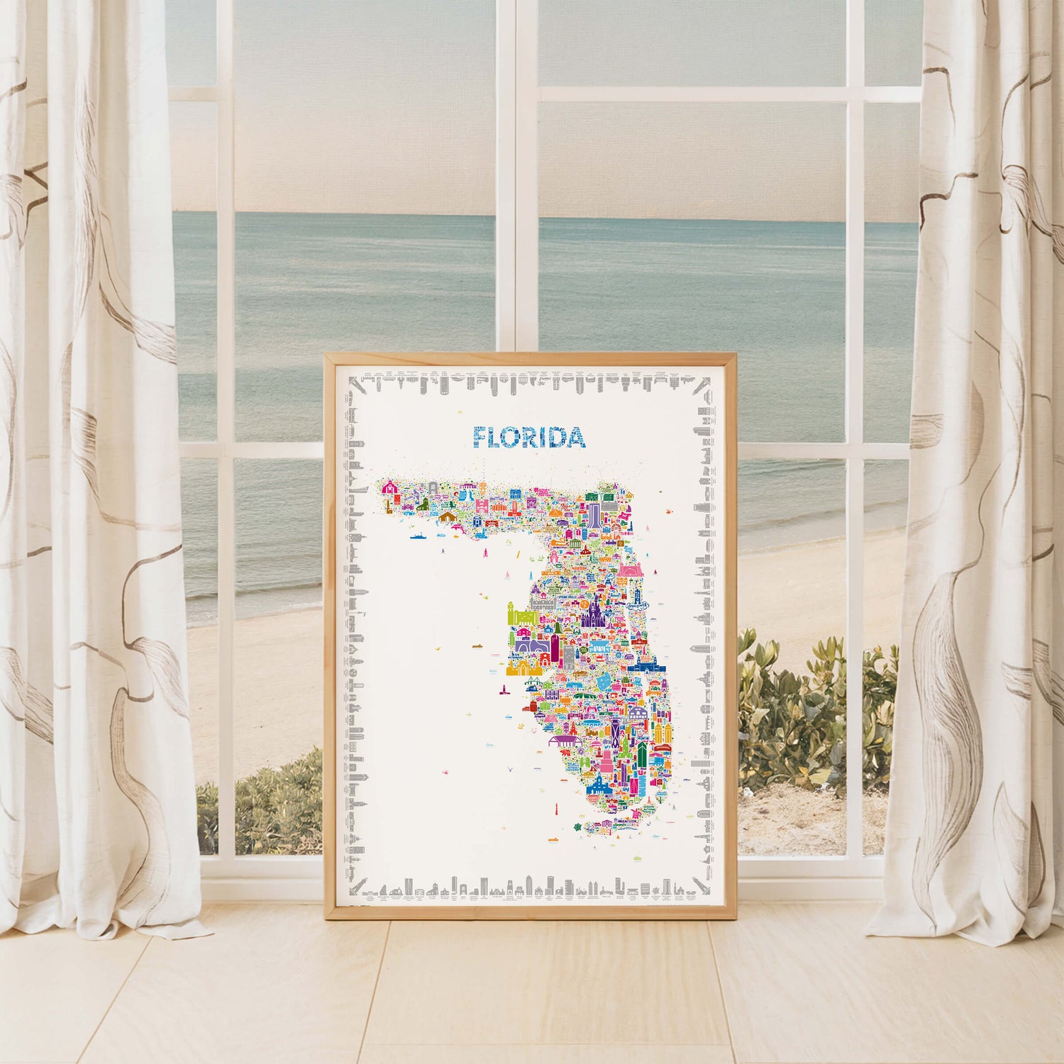 Florida map poster in natural wood frame by window with ocean view, coastal décor and travel-inspired wall art of the Sunshine State