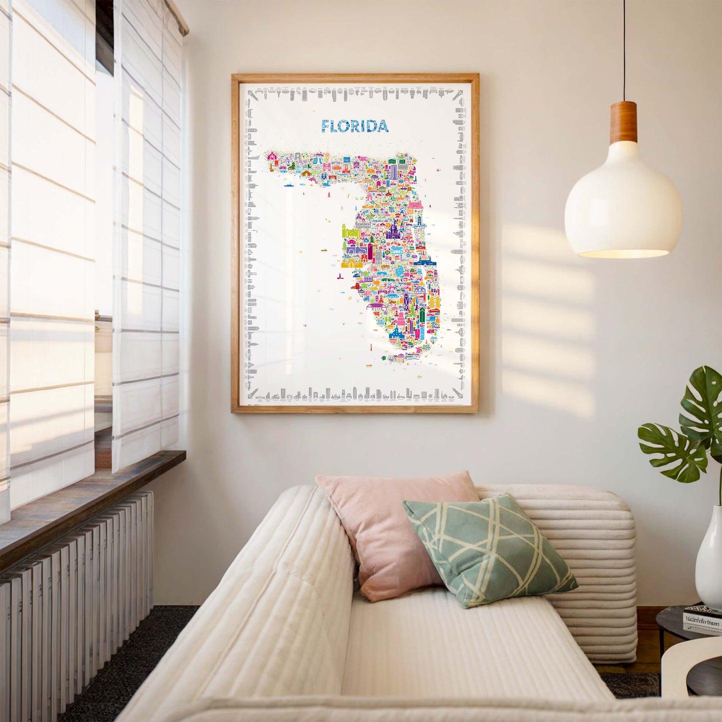 Colorful Florida map poster in wood frame above modern sofa with neutral tones, contemporary wall art décor for living room
