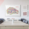 Colorful London map poster on a wall above a table with chairs.