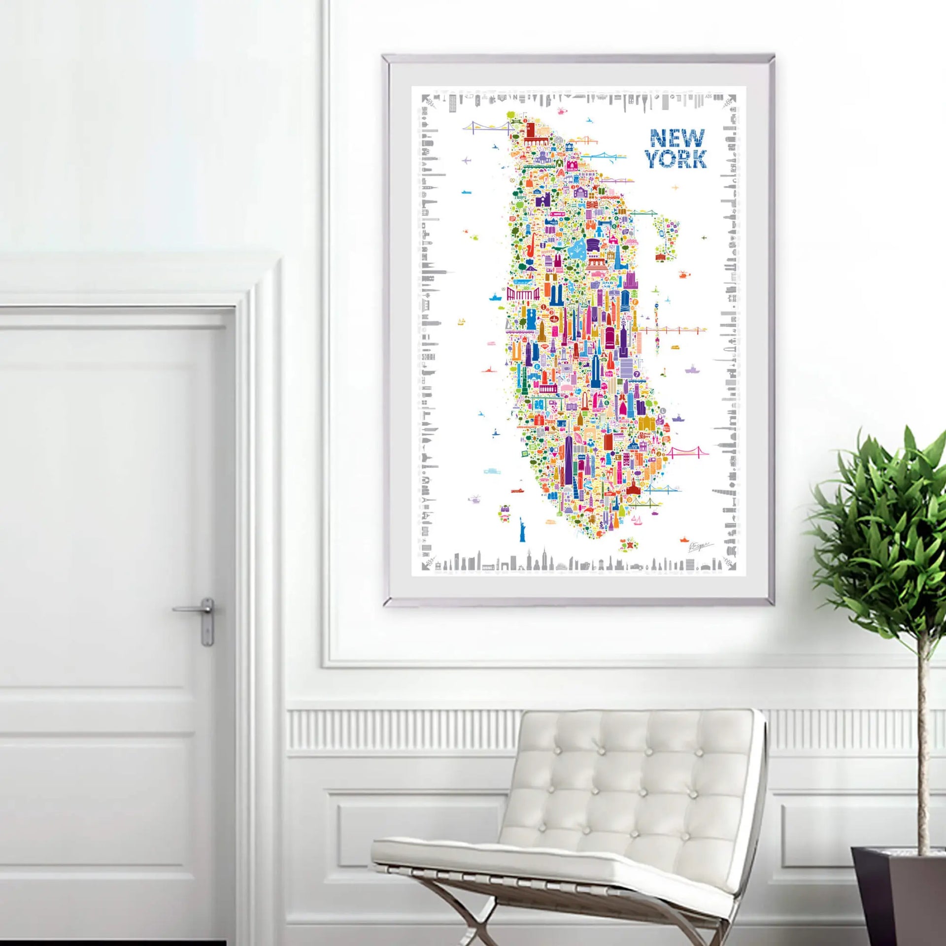 Framed Alfalfa New York illustrated map poster of Manhattan displayed on a white wall in a modern living room with a minimalist chair and indoor plant.