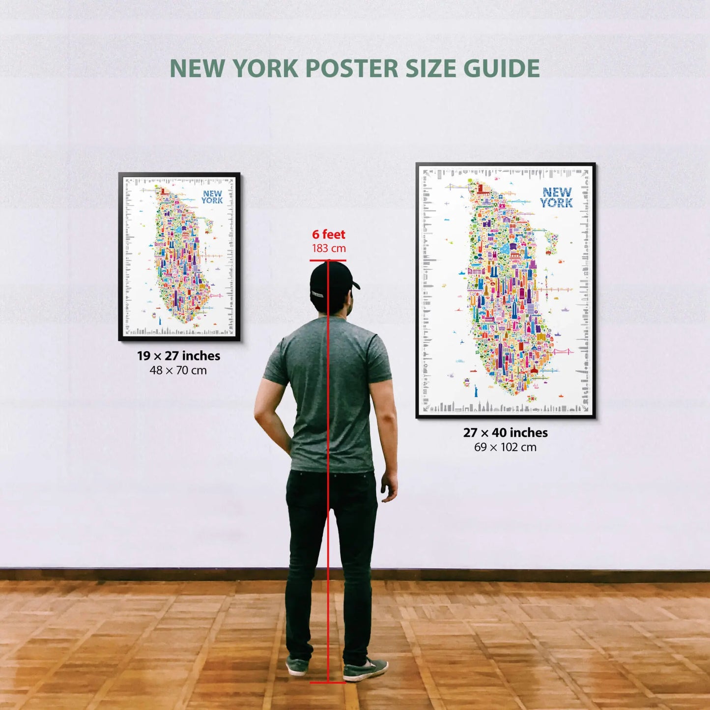 Person standing between two New York poster size guides on a wall.