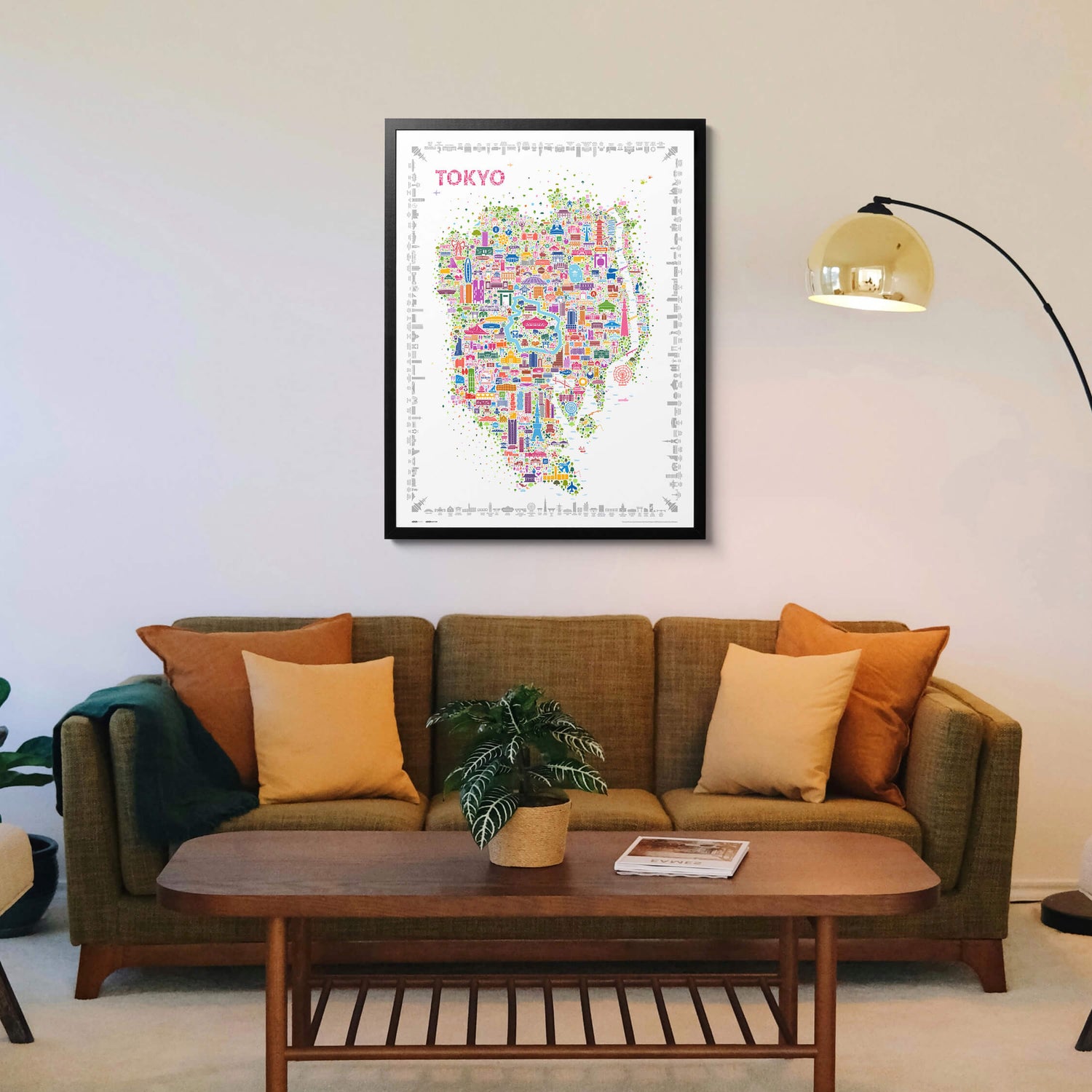 Iconic Tokyo map poster in a black frame above an olive green modern sofa, stylish living room décor with contemporary city artwork