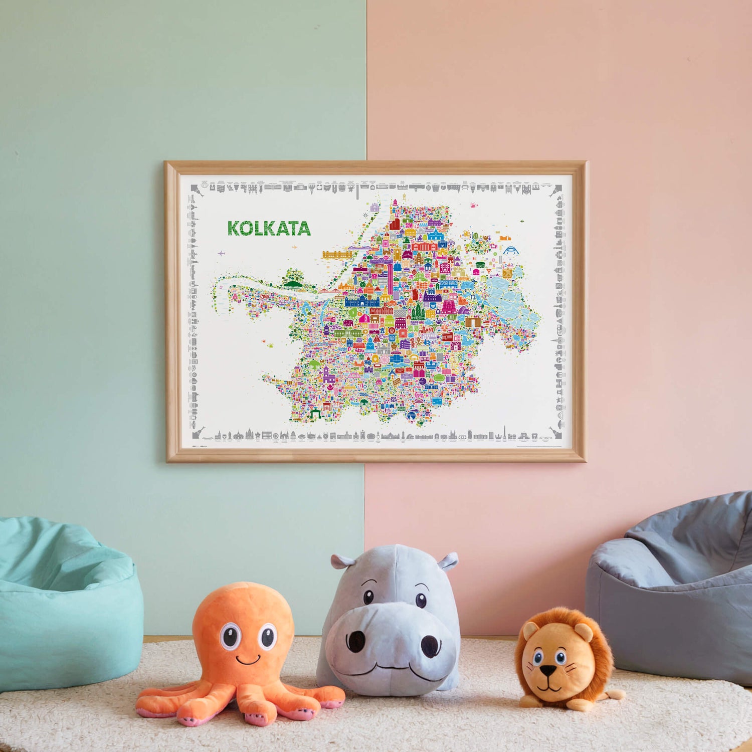 Colorful framed Kolkata illustrated map poster displayed on a pastel wall above plush toys in a playful kids room.