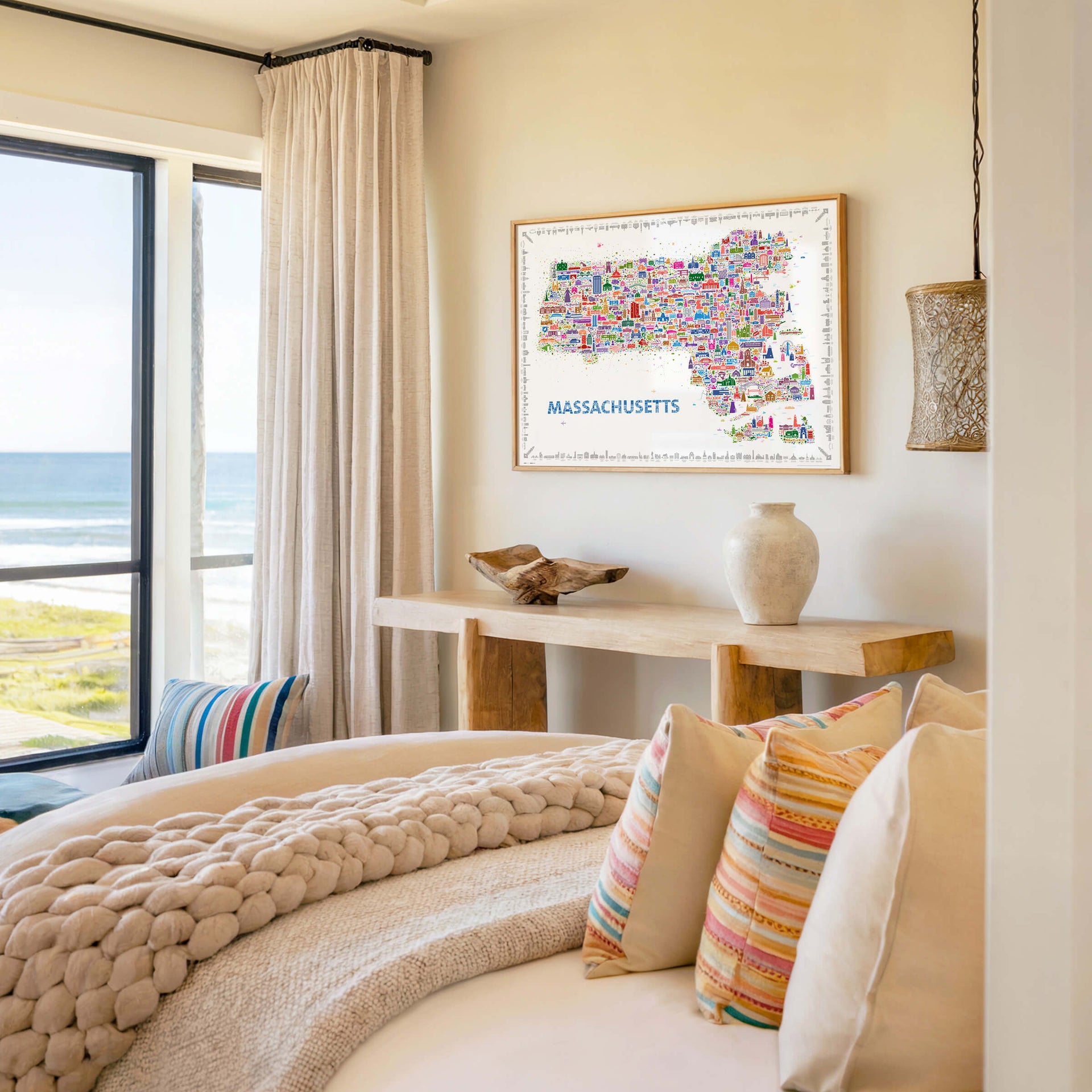 Colorful Massachusetts map poster styled as coastal bedroom wall décor overlooking the ocean. Illustrated travel map artwork featuring Cape Cod, Boston, and New England landmarks in modern designer style.