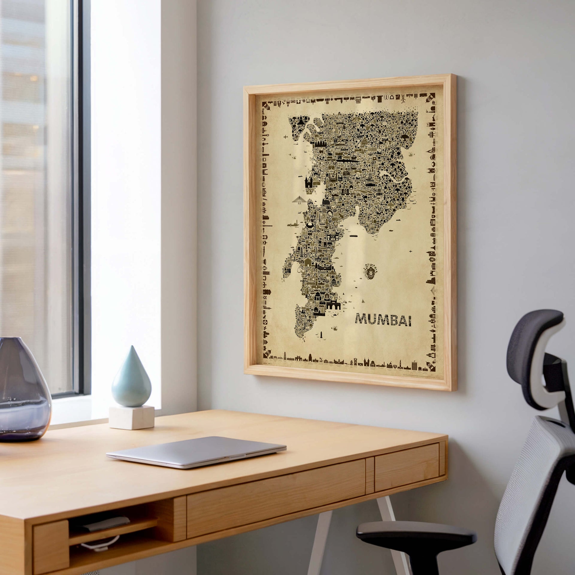 Mumbai antique map poster in a clean home office above wooden desk with minimal modern decor