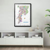 Framed map of Mumbai on a wall above a white shelf with decorative items.