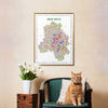 Framed map of New Delhi on a wall above a chair with a cat and a plant.