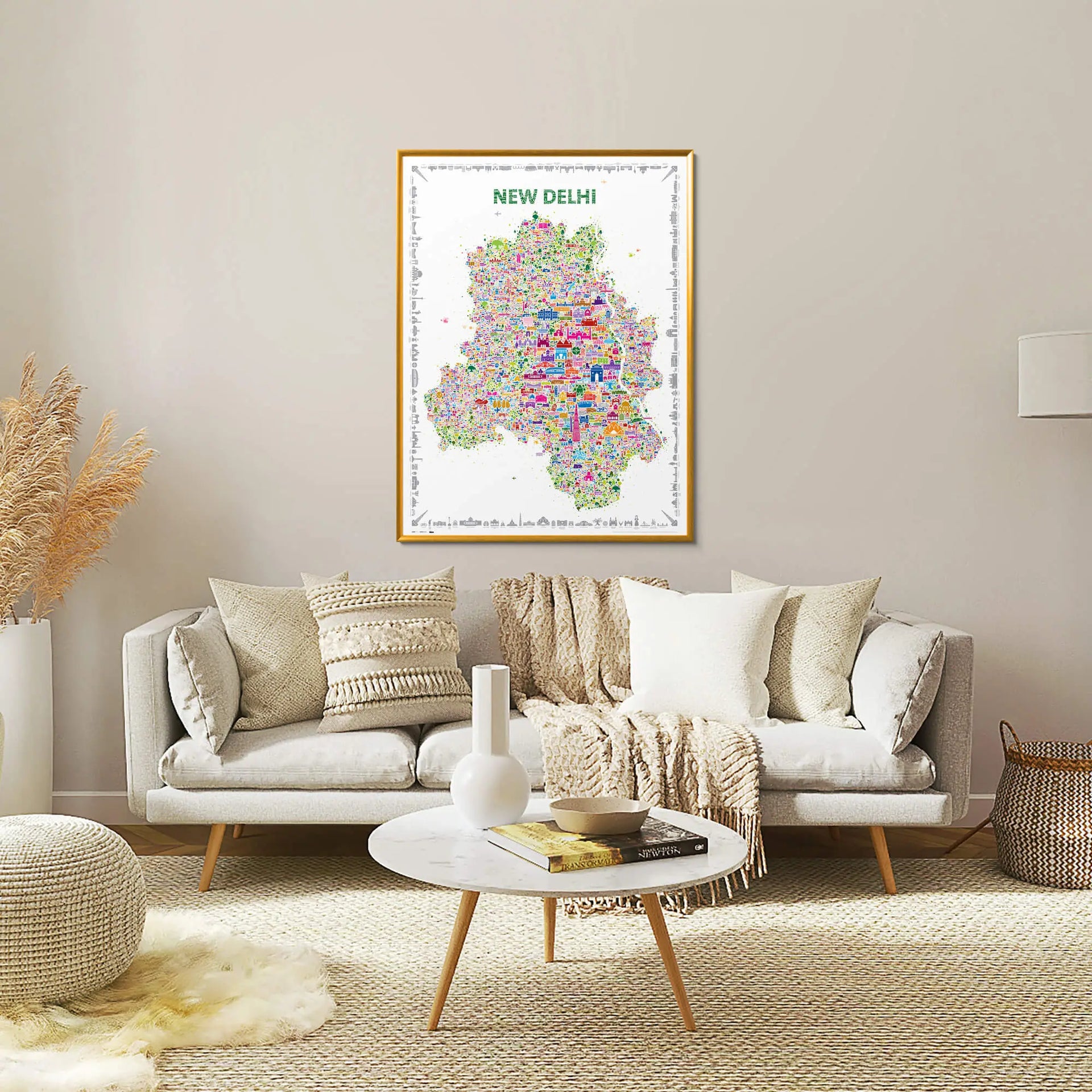 Living room with a sofa, coffee table, and decorative items, featuring a colorful map of New Delhi on the wall.