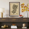 Iconic New Jersey Antique Edition framed in natural wood above an elegant sideboard with decorative accents. Vintage sepia map artwork combining historic charm with modern interior design.