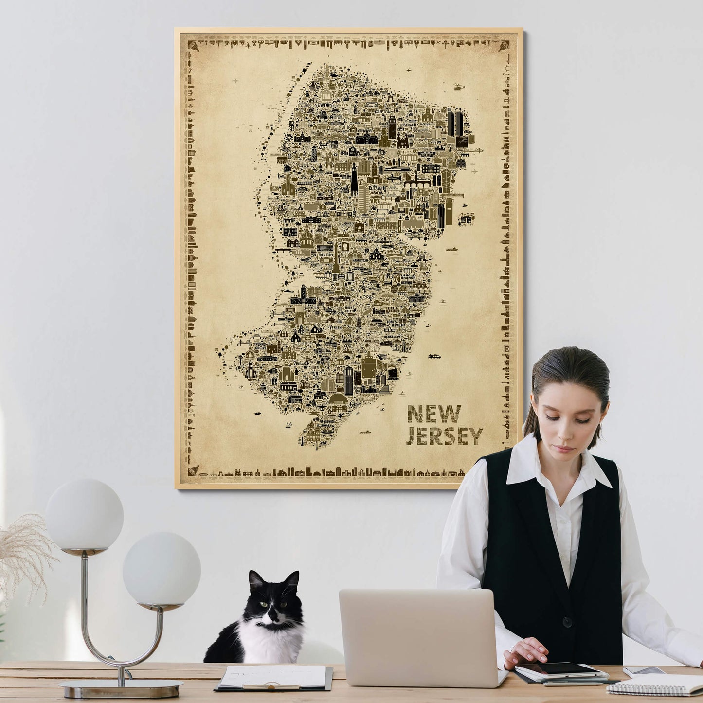 Iconic New Jersey Antique Edition vintage map poster decorating a bright home office where a young professional works beside a tuxedo cat. Elegant sepia wall art with timeless old-world charm and designer appeal.