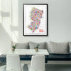 Framed New Jersey city map art print displayed in a bright modern dining space — colorful wall art in black wood frame, premium home decor by Alfalfa New York.