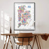 Colorful New York map poster on a wall above a wooden desk with a chair.
