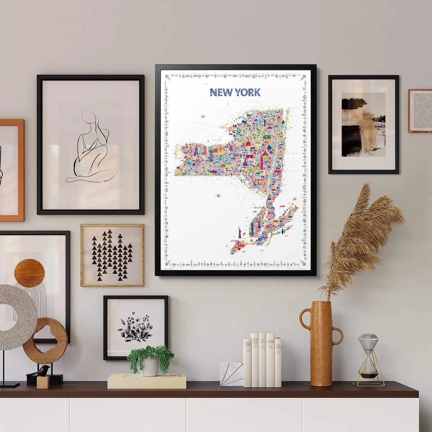 Framed map of New York on a wall with decorative items below