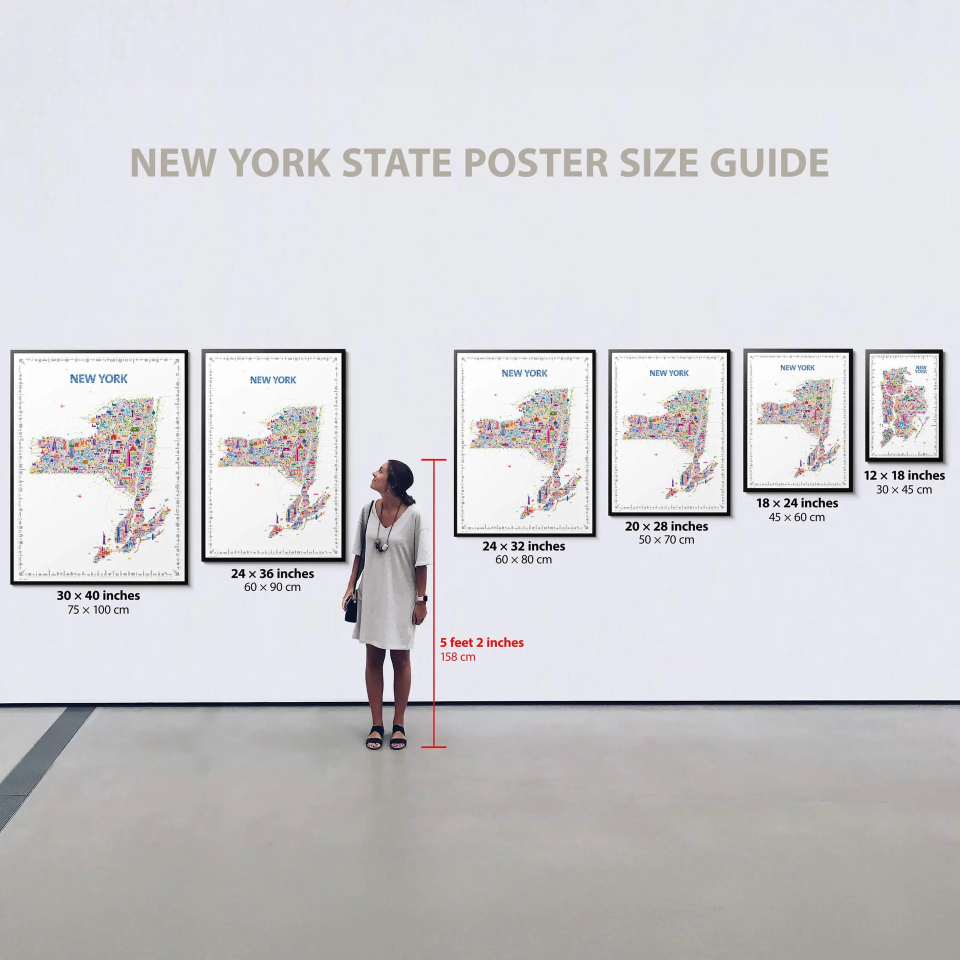 Woman standing in front of a wall displaying New York State posters with size guide measurements.