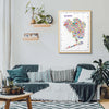 Living room with a colorful map of Queens on the wall above a sofa.