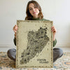 Woman holding the unframed Iconic Staten Island Antique Edition illustrating the actual scale of the premium matte paper poster. Perfect Staten Island gift and New York wall art.