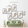 Colorful Staten Island illustrated map poster size guide showing seven framed print sizes from 12 x 18 to 30 x 40 inches above a green sofa.