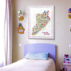 Colorful Staten Island map on a wall above a bed in a child's room.