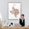 Woman working at a desk with a colorful Texas map poster on the wall.