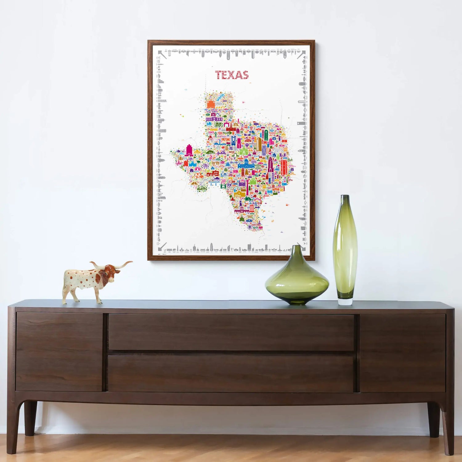Colorful Texas map poster on a wall above a wooden console table with decorative items.